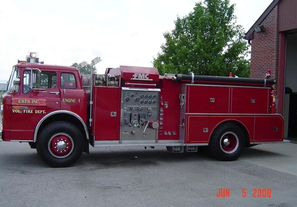 Red fire truck outside fire station